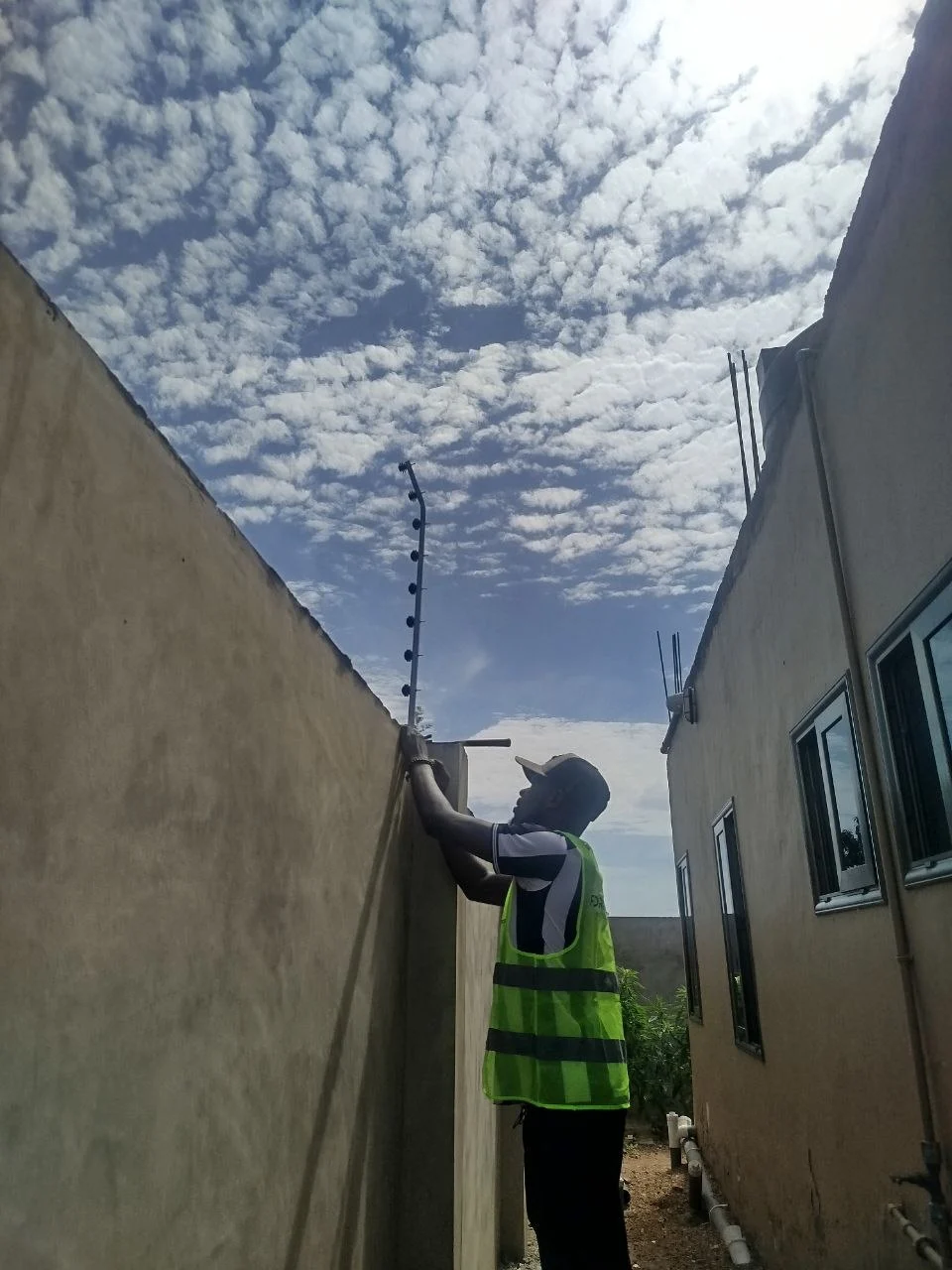 Electric fence installation team securing conductor strands