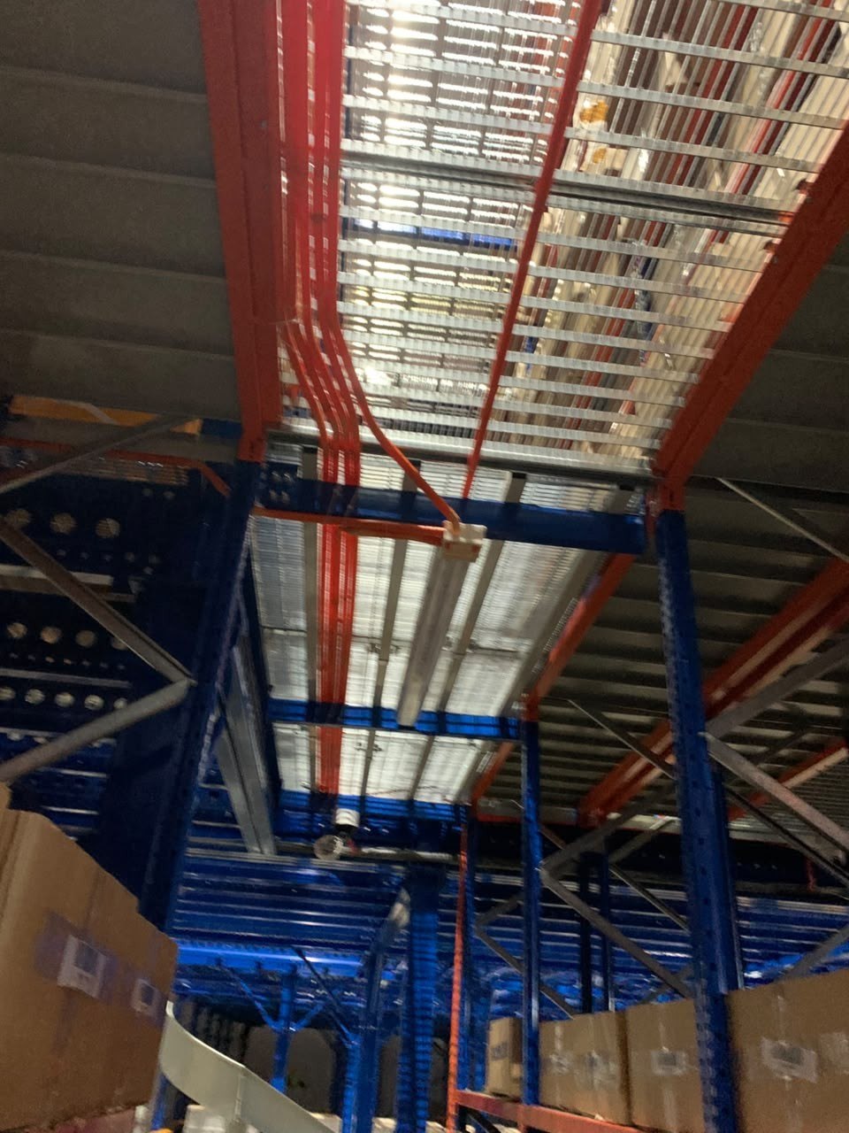 Racking and lighting installation in warehouse